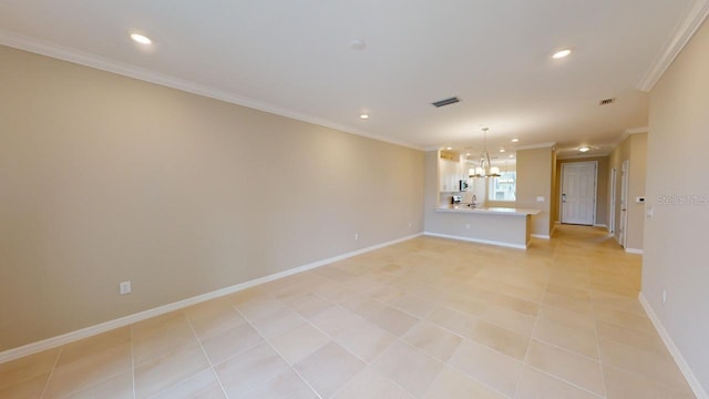 unfurnished living room featuring light tile patterned flooring, sink, crown molding, and a notable chandelier