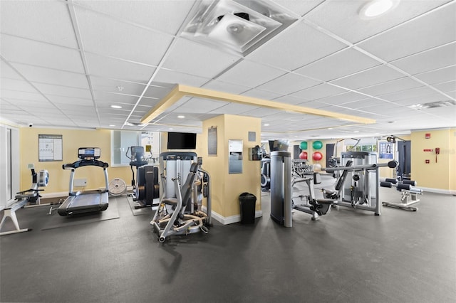 gym featuring a paneled ceiling