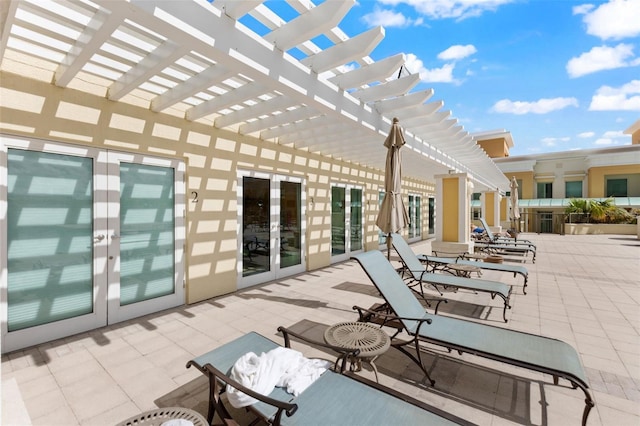 view of patio / terrace featuring a pergola and french doors