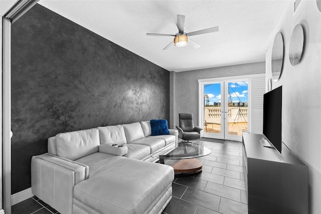 tiled living room with a textured ceiling and ceiling fan