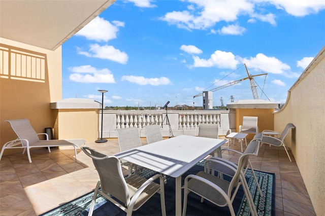 view of patio featuring a balcony