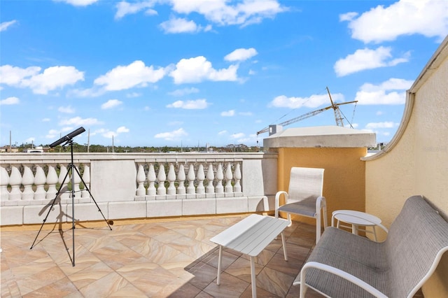 view of patio with a balcony