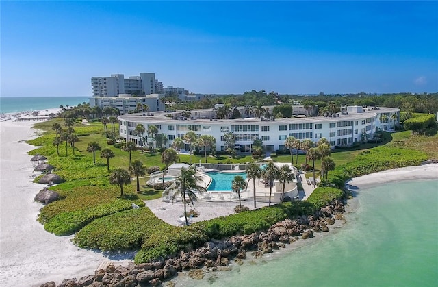 aerial view featuring a view of the beach and a water view