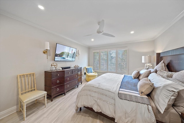 bedroom with ornamental molding, ceiling fan, and light hardwood / wood-style floors