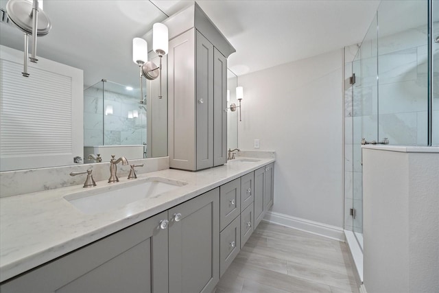 bathroom featuring vanity, walk in shower, and wood-type flooring