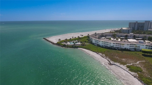 drone / aerial view featuring a view of the beach and a water view