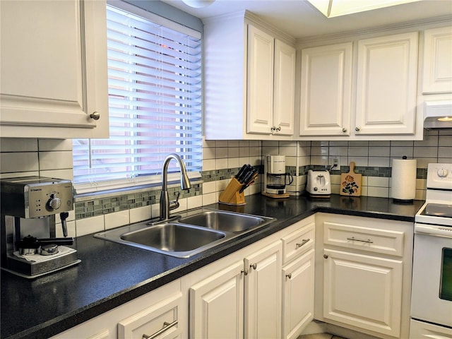 kitchen with backsplash, white electric range oven, white cabinetry, and sink