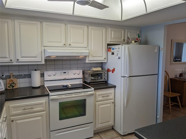 kitchen with backsplash, light tile patterned floors, exhaust hood, and white appliances