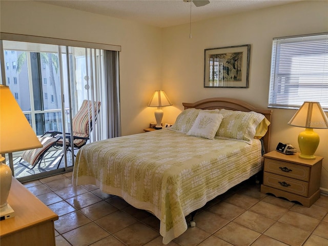 tiled bedroom featuring ceiling fan