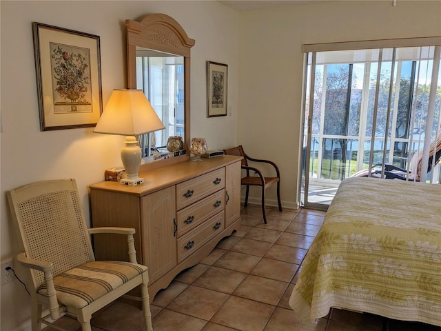 tiled bedroom with access to exterior