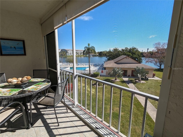 balcony featuring a water view