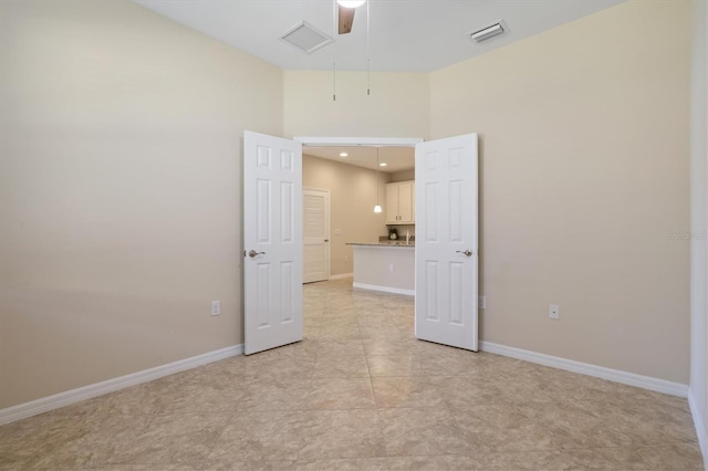 empty room with light tile patterned floors