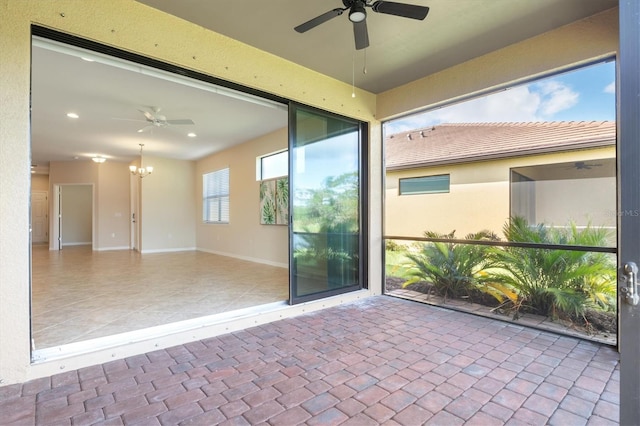 view of patio featuring ceiling fan