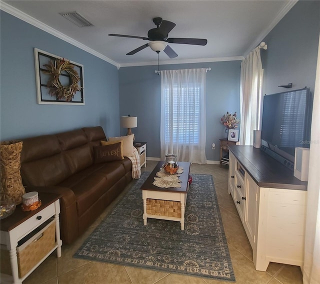 tiled living room featuring ceiling fan and crown molding