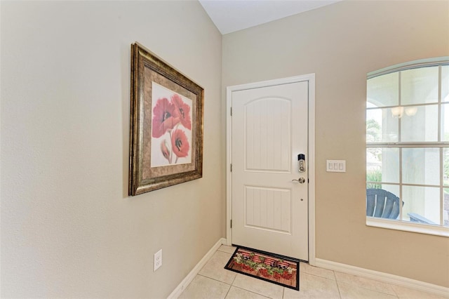 entryway with light tile patterned floors