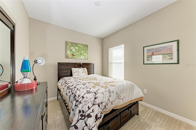 bedroom with light carpet