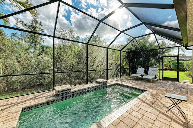 view of pool with a lanai and a patio area