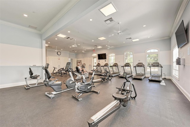 workout area featuring ceiling fan and crown molding