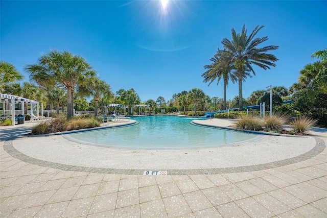 view of swimming pool with a patio