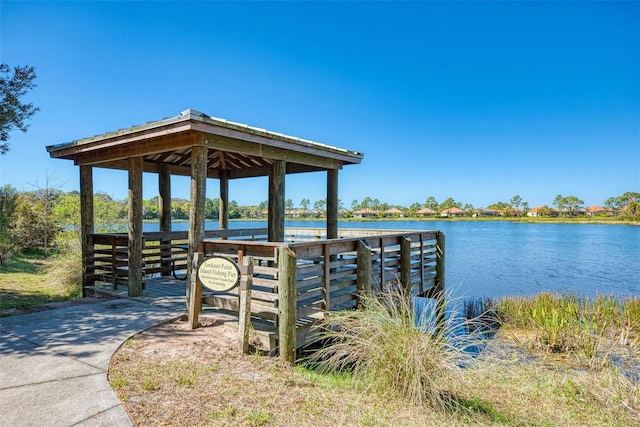 view of dock featuring a gazebo and a water view