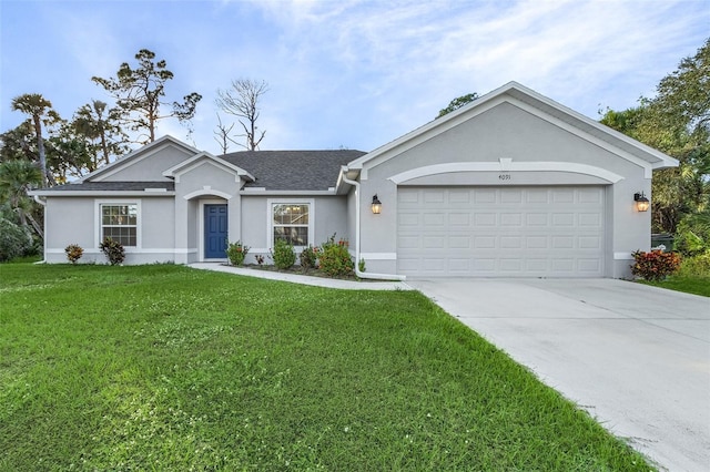 ranch-style home featuring a garage and a front lawn