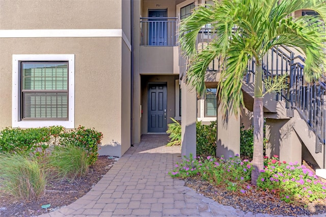 entrance to property with a balcony