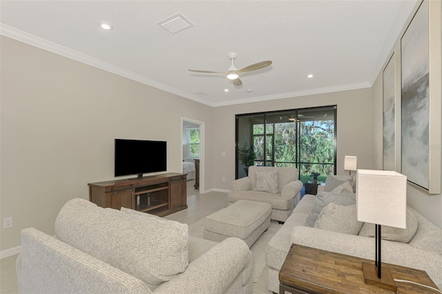 living room with ceiling fan and crown molding