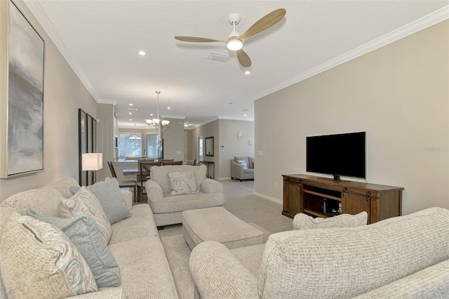 tiled living room featuring ceiling fan with notable chandelier and crown molding