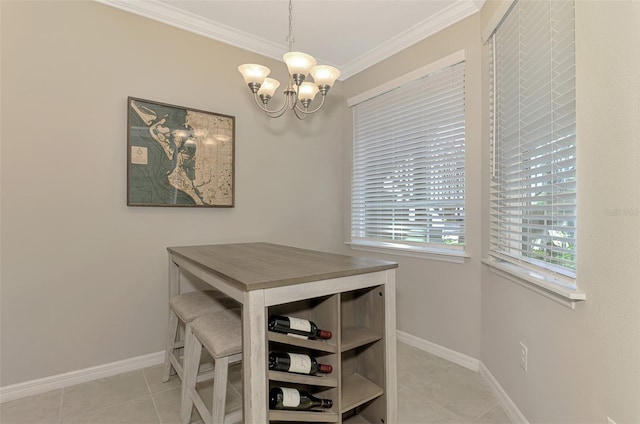 tiled dining space featuring ornamental molding and an inviting chandelier