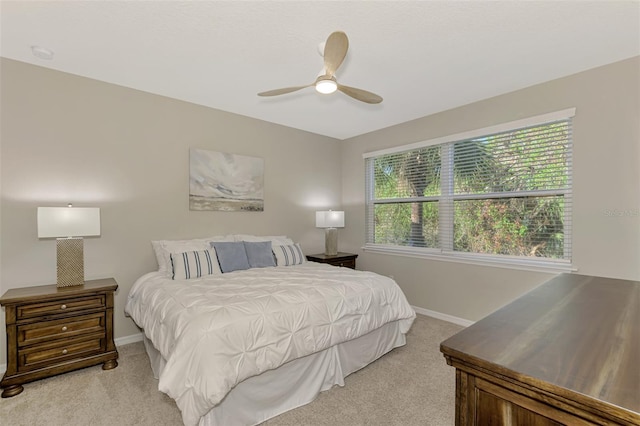 bedroom with light carpet and ceiling fan