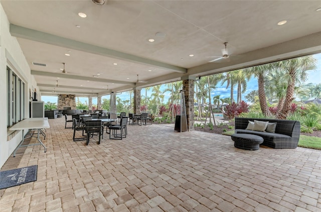 view of patio featuring an outdoor living space and ceiling fan