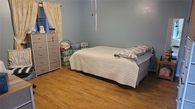 bedroom featuring hardwood / wood-style flooring