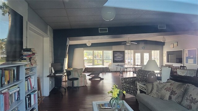 living room featuring hardwood / wood-style flooring, ceiling fan, and lofted ceiling