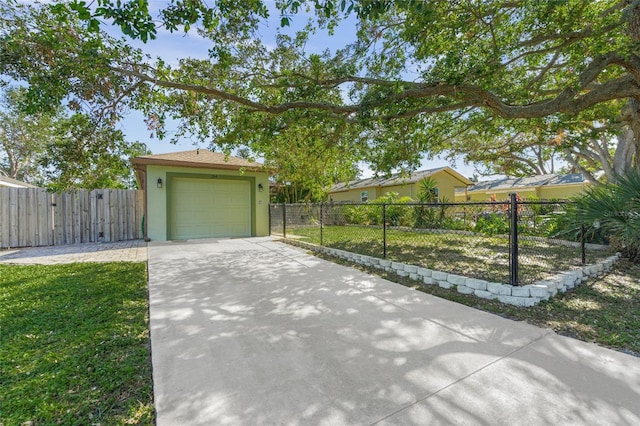 view of front of property featuring a front yard and a garage