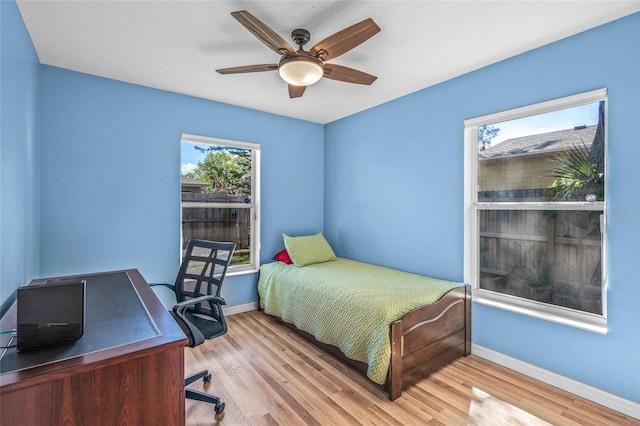 bedroom featuring ceiling fan and light hardwood / wood-style floors