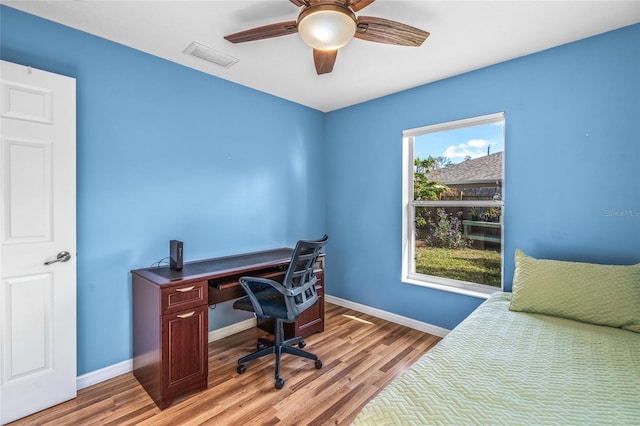 office space with ceiling fan and light hardwood / wood-style flooring