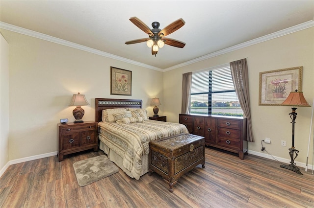 bedroom featuring ceiling fan, dark hardwood / wood-style floors, and ornamental molding