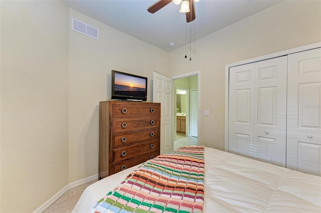 bedroom featuring light carpet, a closet, and ceiling fan