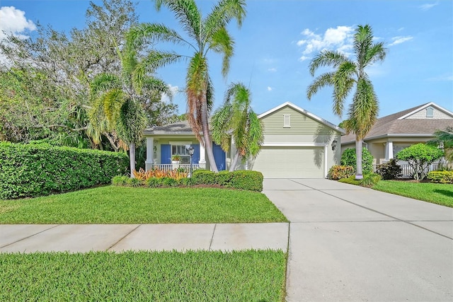 view of front of property with a front lawn and a garage