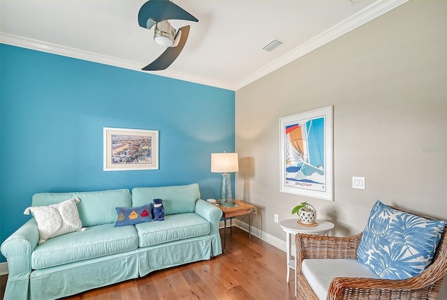 living room featuring ornamental molding and hardwood / wood-style flooring