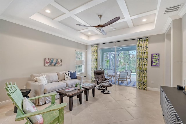 tiled living room with ceiling fan, coffered ceiling, and ornamental molding