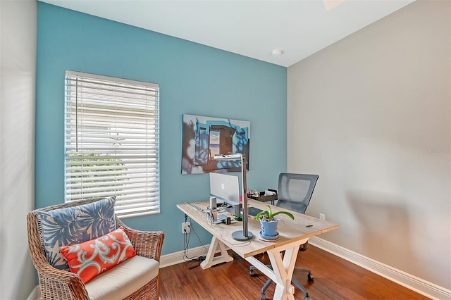 home office with hardwood / wood-style floors