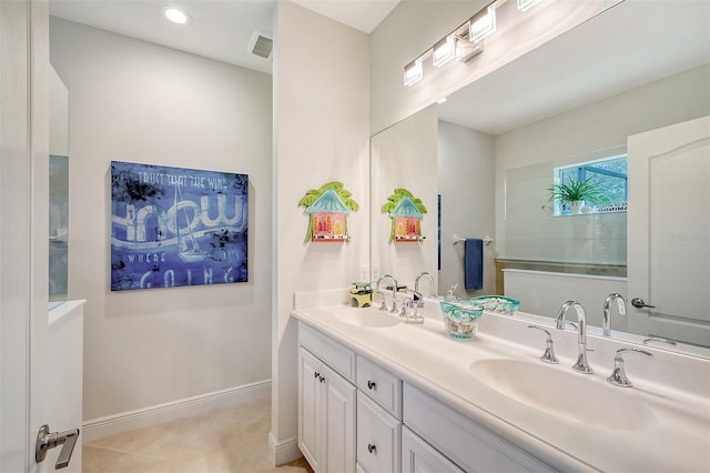 bathroom with tile patterned flooring and vanity