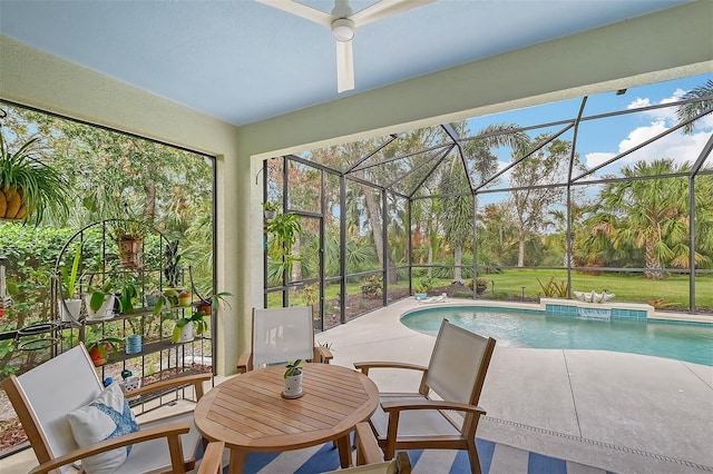 view of swimming pool featuring a yard, a lanai, and a patio area