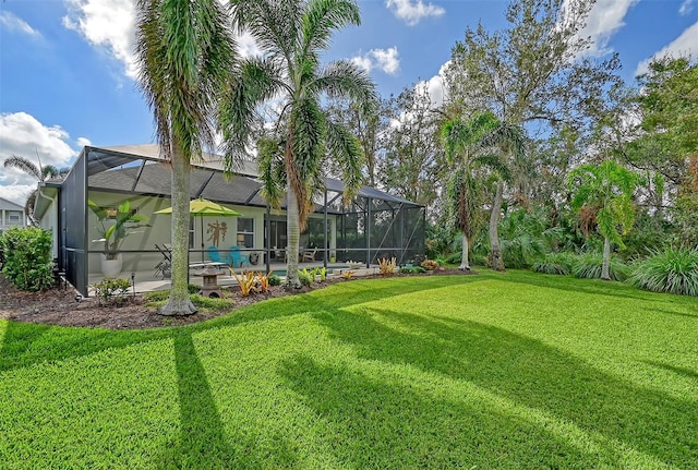 view of yard featuring glass enclosure