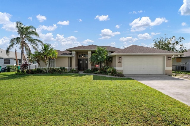 view of front of house with a garage and a front lawn