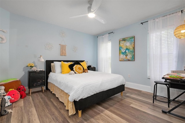 bedroom featuring ceiling fan and hardwood / wood-style flooring