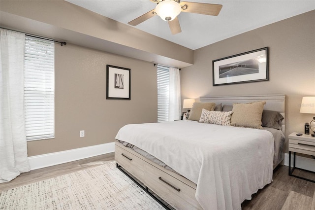 bedroom featuring wood-type flooring and ceiling fan