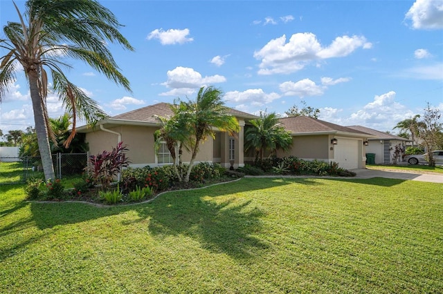 single story home with a front yard and a garage