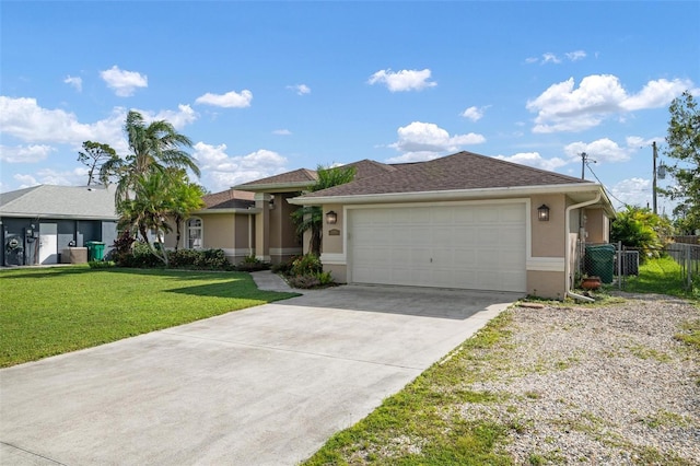 view of front of home featuring a front lawn and a garage